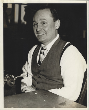 Andrew E. Svenson at typewriter